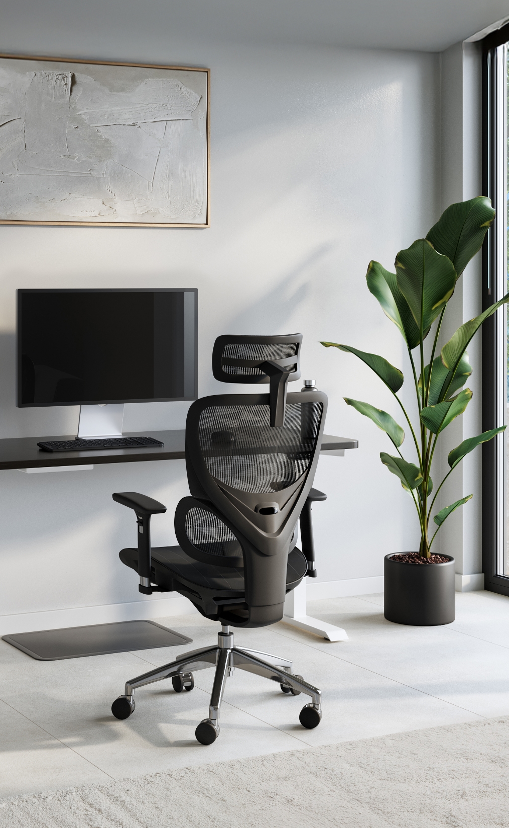 Modern home office with MotionGrey standing desk and ergonomic chair