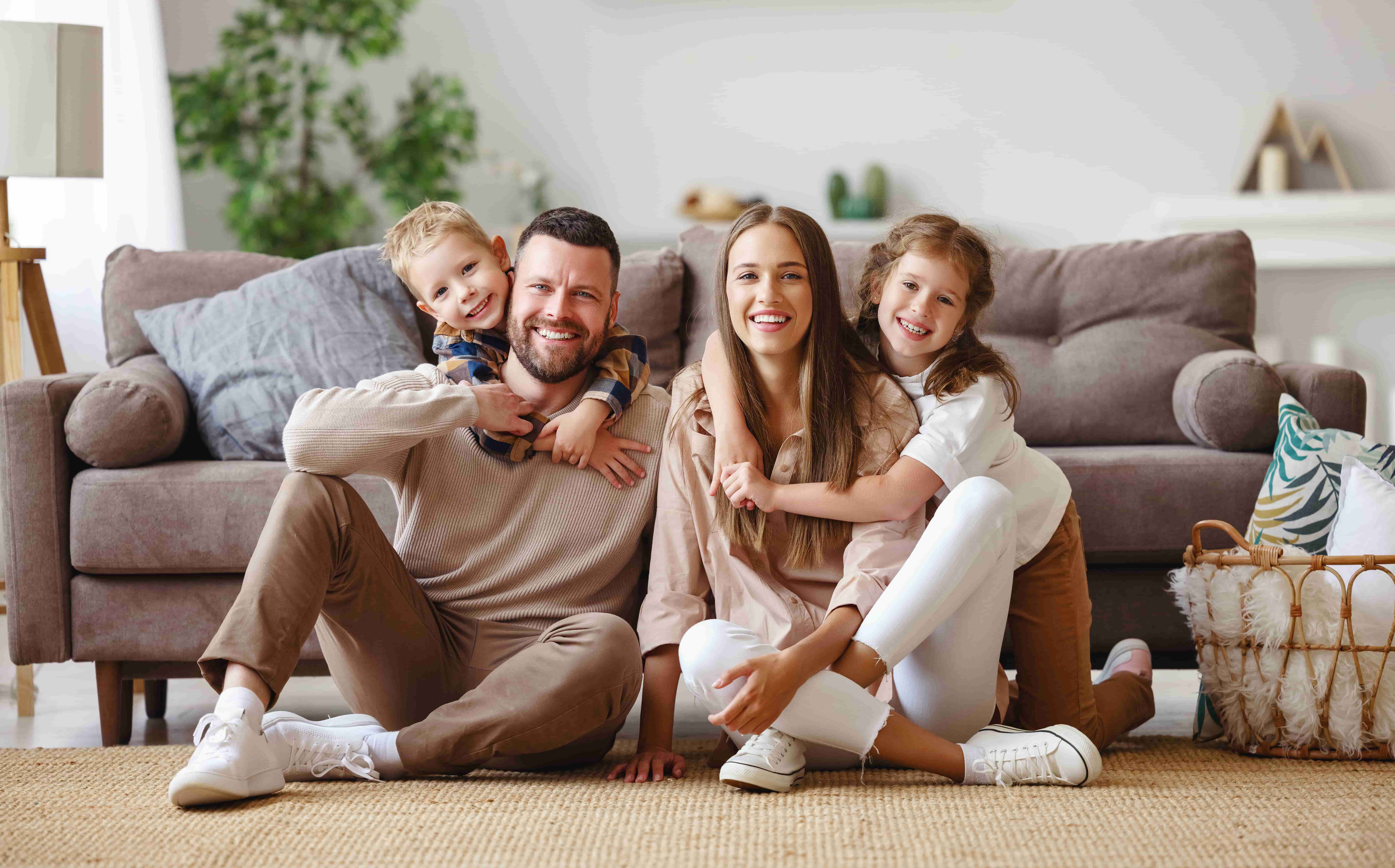 Family gathered in comfortable living room with stylish furniture